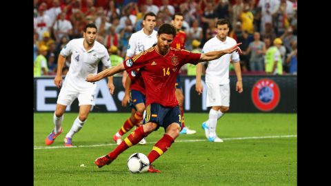 Xabi Alonso of Spain scores the second goal from the penalty spot during the quarter final match between Spain and France at Donbass Arena on Saturday, June 23, in Donetsk, Ukraine.
