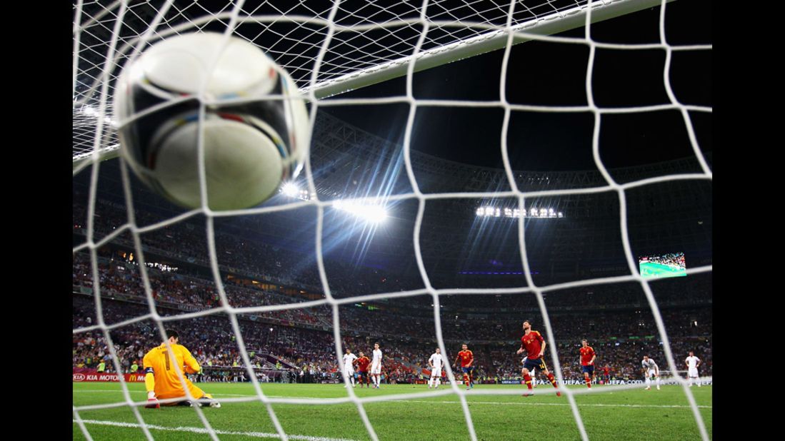 Xabi Alonso of Spain scores the second goal from the penalty spot during the quarter final match between Spain and France.
