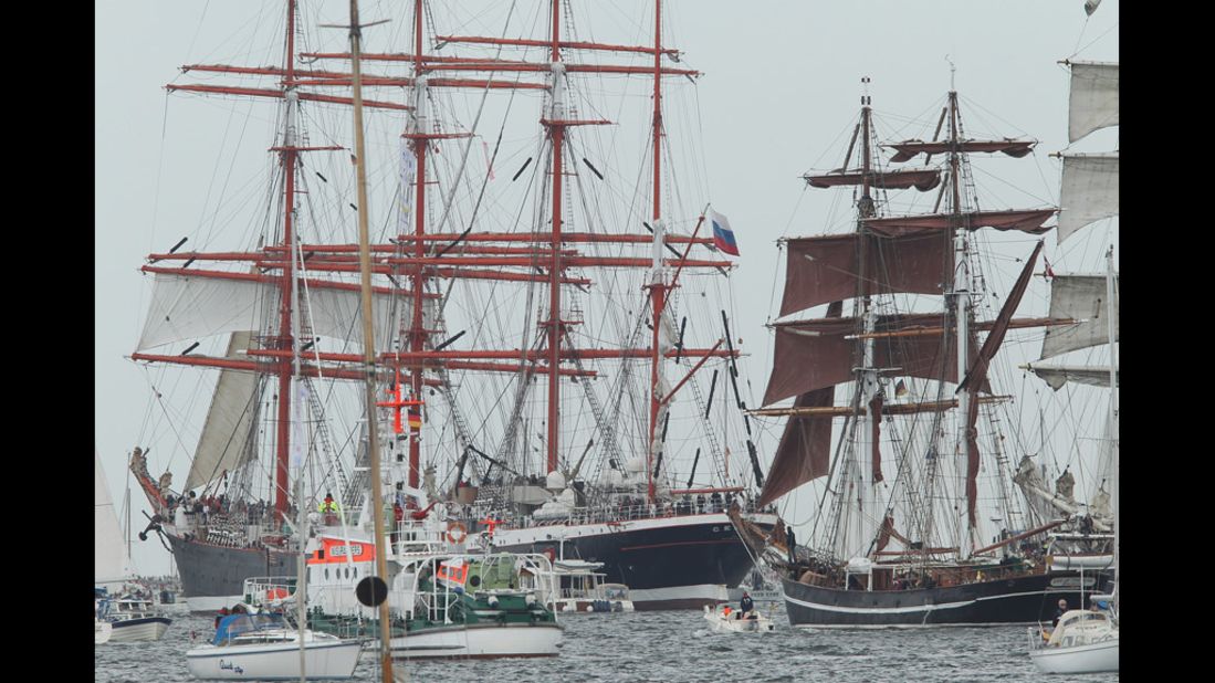 Tall ships participating in the Windjammer Parade head out sea.