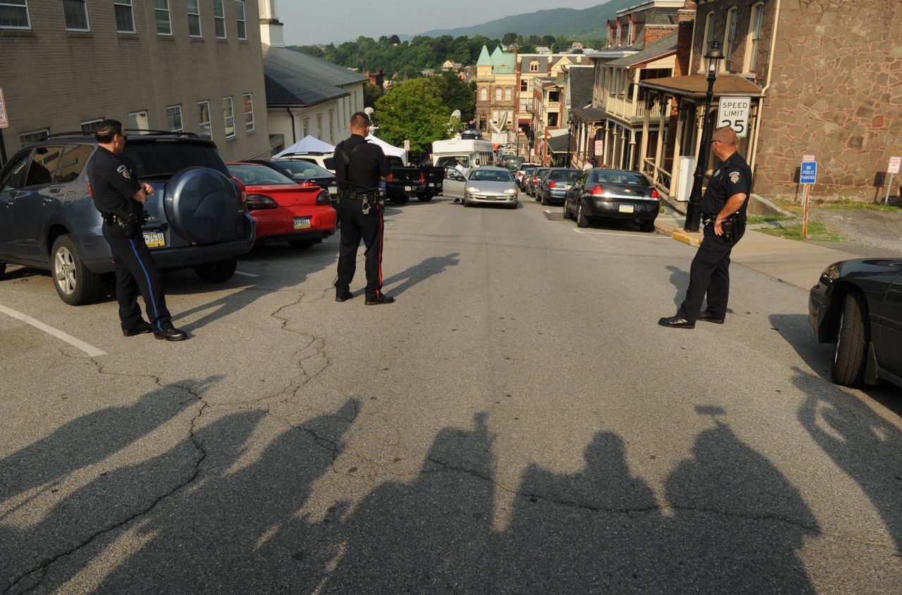Shadows of the media are seen outside the courthouse during the second day of deliberations. Jurors took 21 hours over two days to convict Sandusky on 45 of 48 charges against him.