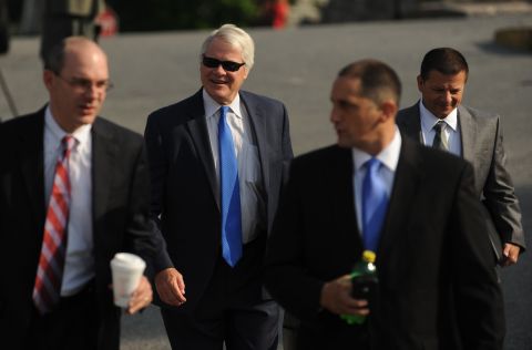 Prosecutor Joseph E. McGettigan III, second from left, and the rest of his prosecution team arrive at the courthouse Friday. 