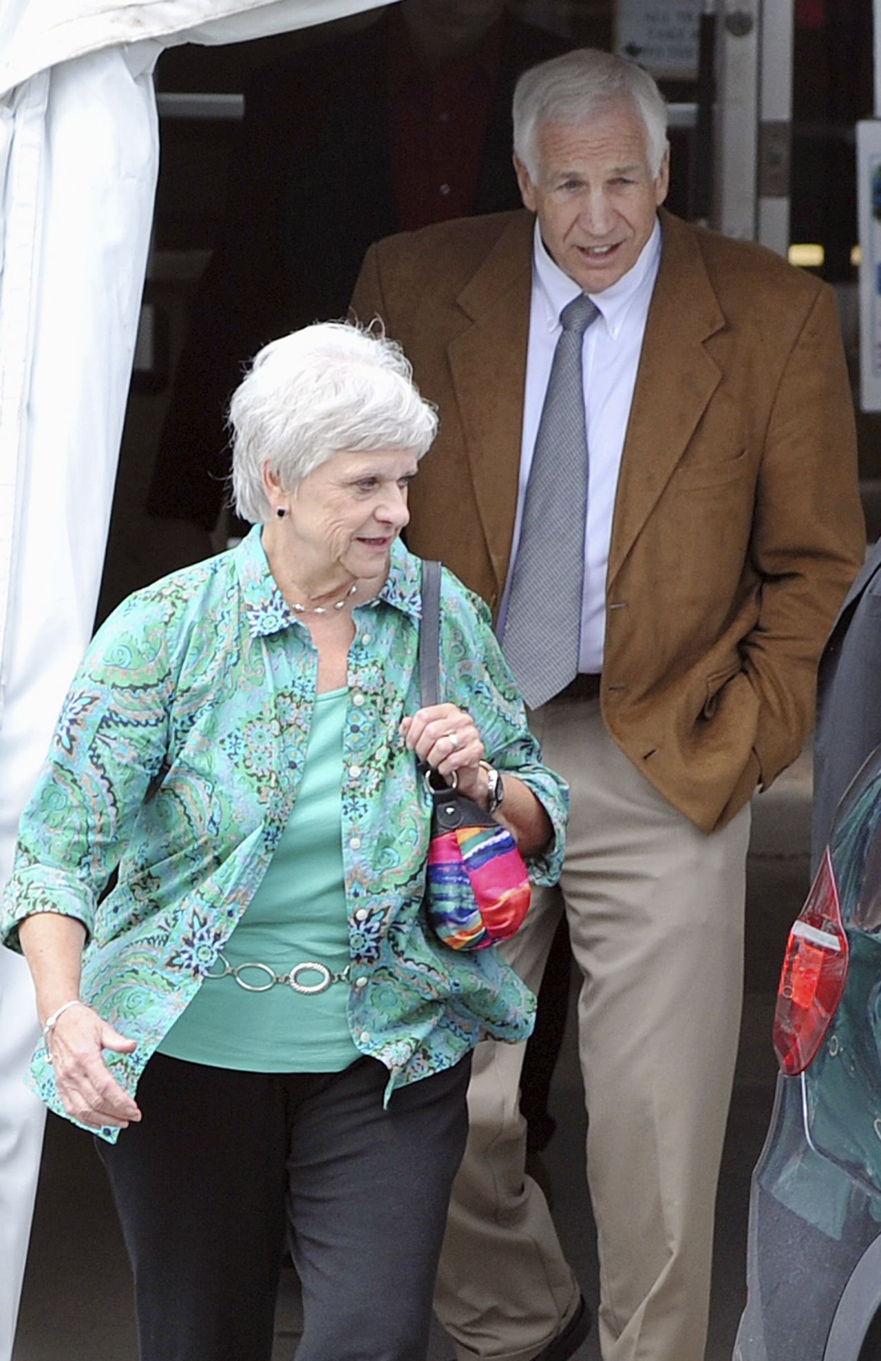 Dottie Sandusky, who has been married to Sandusky for 46 years, walks with her husband while jurors deliberate. She testified that she did not witness any sexual abuse.