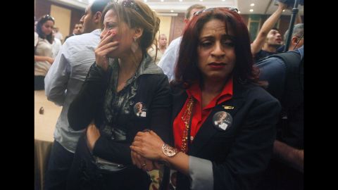 Supporters of presidential candidate Ahmed Shafik react after hearing the results of the presidential elections in Cairo on June 24. 