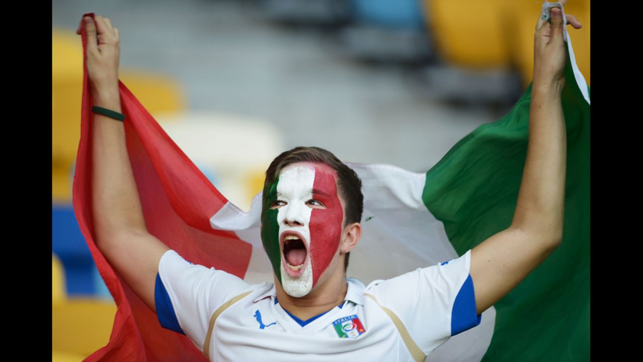 An Italy fan enjoys the atmosphere ahead of Sunday's quarterfinal match.