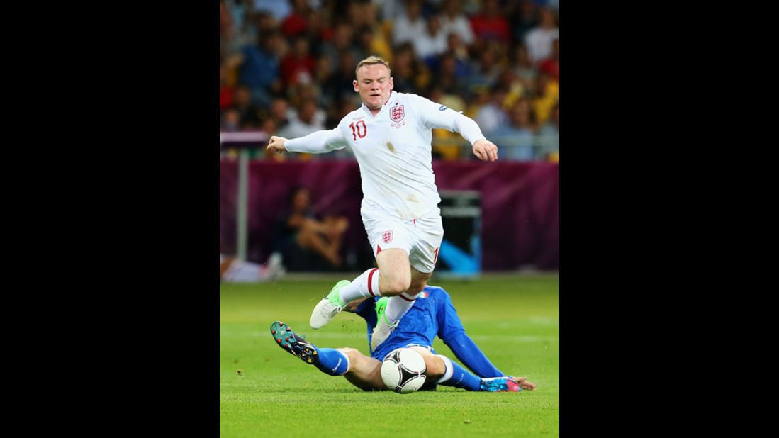  Wayne Rooney of England goes after the ball during the match against Italy.