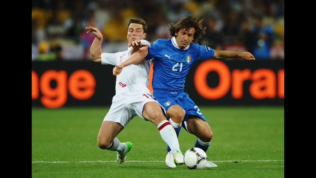 Scott Parker of England and Andrea Pirlo of Italy compete for the ball Sunday.