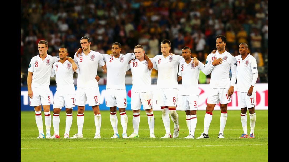 The English players line up during the penalty shootout against Italy.