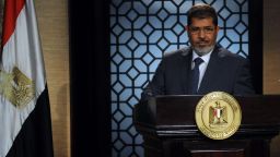 Egypt's new president-elect, Mohamed Morsi, gives a speech in the studio of the state television in Cairo on June 24, 2012.