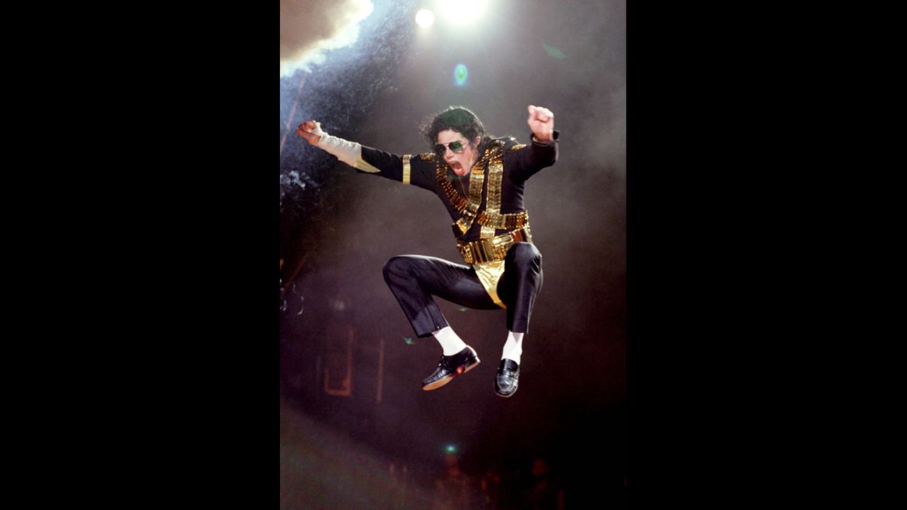 Known for his dance moves, Jackson is seen here jumping while performing during the Dangerous tour in 1992.
