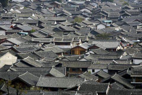  Lijiang, an ancient town set in a dramatic mountain landscape in the southwestern province of Yunnan has struggled to accommodate a surge in tourists. It receives 11 million visitors a year.
