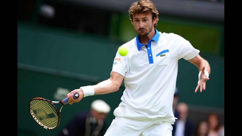 Spain's Juan Carlos Ferrero plays a forehand shot during his first round men's singles match against Serbia's Novak Djokovic.