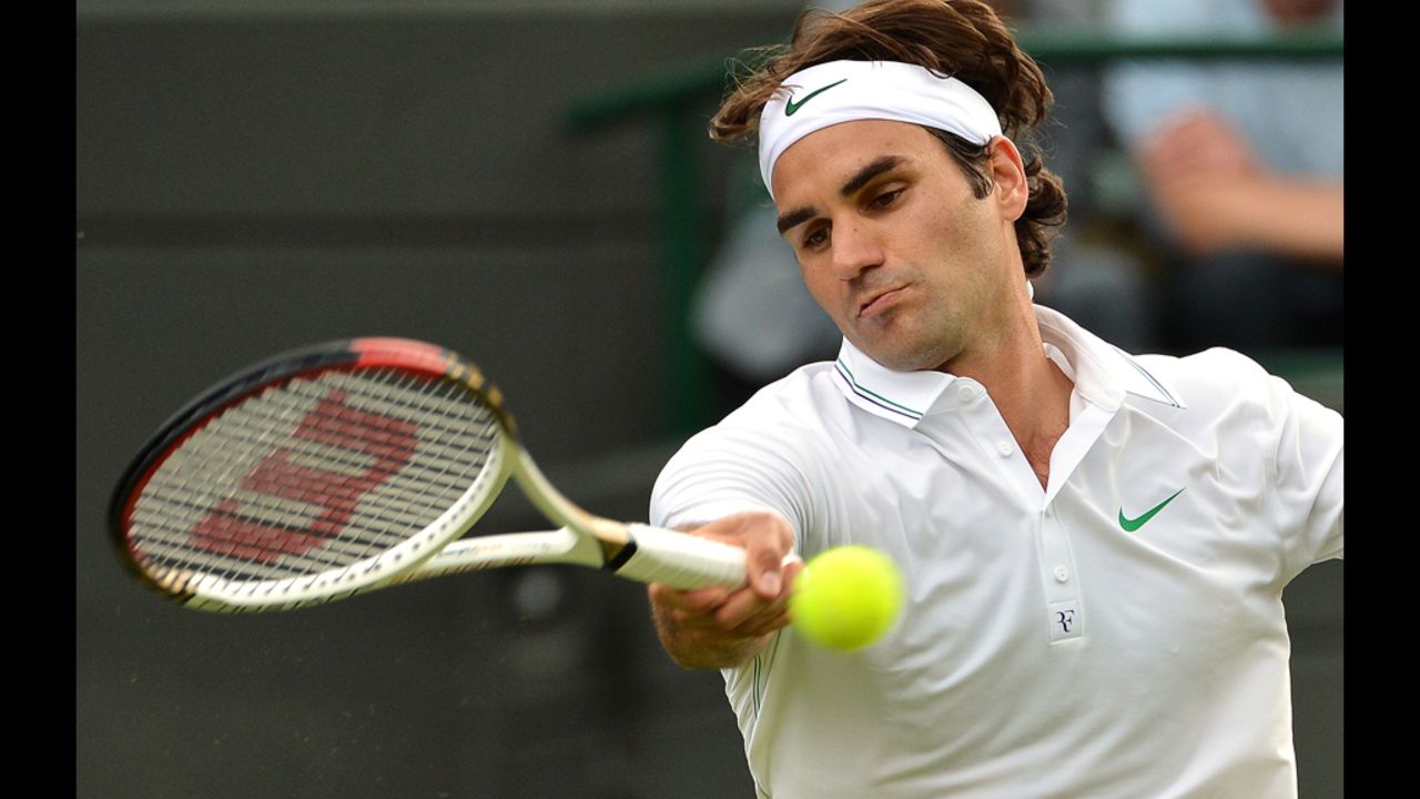 Switzerland's Roger Federer plays a forehand shot during his first round men's singles match against Spain's Albert Ramos.