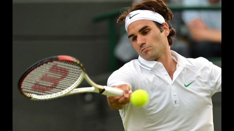 Switzerland's Roger Federer plays a forehand shot during his first round men's singles match against Spain's Albert Ramos.