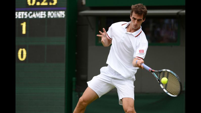 Ramos hits a forehand shot during his match against Federer.