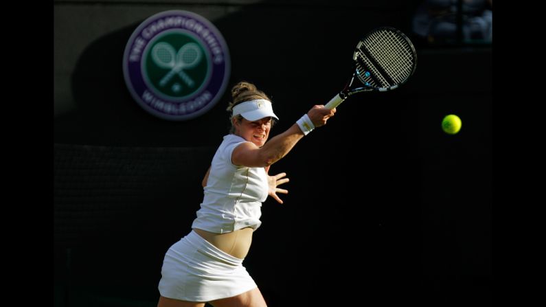 Clijsters hits a backhand return.