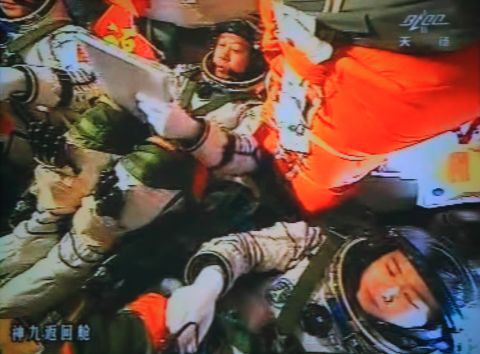 Three Chinese astronauts in the Shenzhou-9 spacecraft prepare for docking with the Tiangong-1 module on July 18, 2012.
