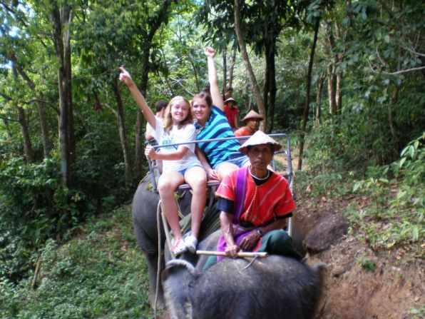 Monica and Kara Disberger ride an elephant in Phuket, Thailand. The family's traveling lifestyle is "within the means of a lot of folks," says Dennis Disberger. "You just budget." 