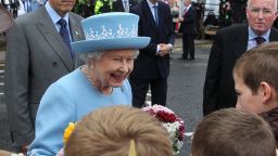 Queen Elizabeth II is in Northern Ireland for a historic meeting with Martin McGuinness, a former IRA leader.
