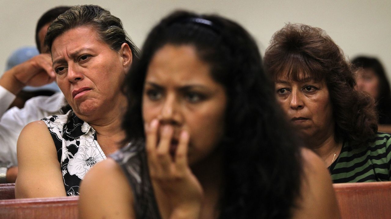 Residents listen as immigrant activists speak about Arizona's law last July.