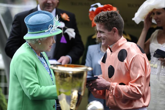 Jockey Luke Nolen is congratulated by Queen Elizabeth II after riding Black Caviar to a narrow win in the Diamond Jubilee Stakes.