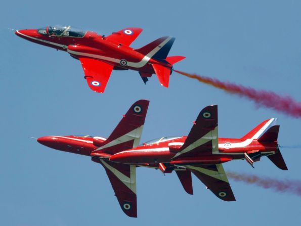 Members of the British Royal Airforce's "Red Arrows" aerial display perform stunts over Farnborough in 2004.