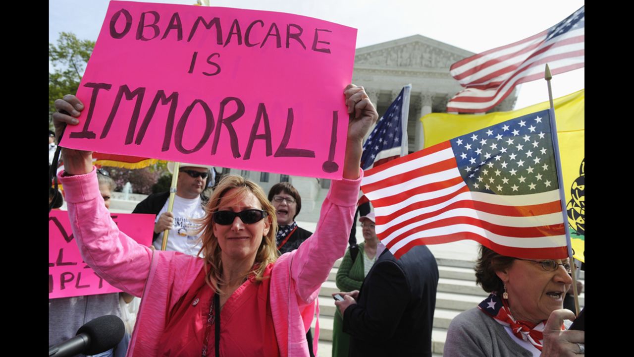 Opponents of Obama's health care legislation protest in front of the Supreme Court on March 28. Critics argued the law's requirement that most Americans have health insurance or pay a fine was an unconstitutional intrusion on individual freedom.