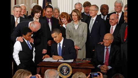 President Barack Obama signs the health care legislation in a March 23, 2010, ceremony with Democrats in the White House East Room. The law, which critics dubbed Obamacare, is Obama's signature legislation.