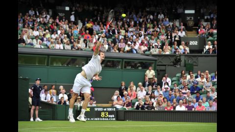 Britain's Andy Murray serves during his first-round singles victory over Russia's Nikolay Davydenko on June 26.