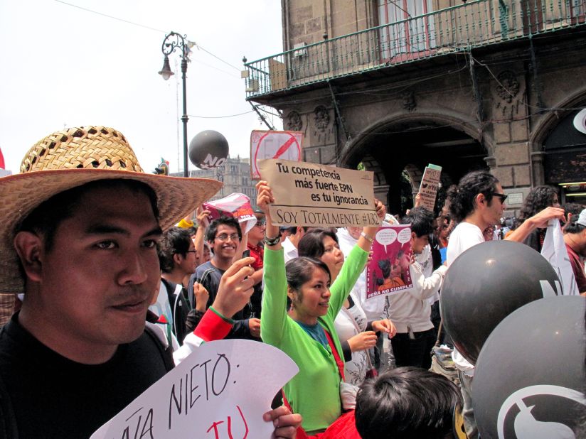 Youth demonstrators march in Mexico City, protesting presidential candidate Enrique Pena Nieto.