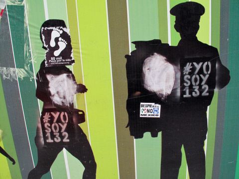Graffiti supporting the #YoSoy132 youth protest movement covers a wall in Mexico City.
