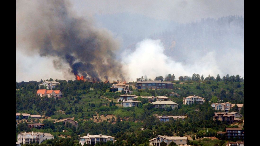 Trees burn on a ridge above Cedar Heights in Colorado Springs, Colorado, on June 24. 