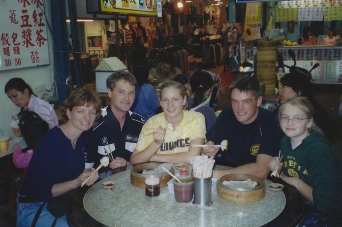 Left to right, Martha, Dennis, Kara, Joel and Monica Disberger have flown a total of 7.5 million miles, according to United Airlines. In this undated snapshot, they enjoyed a meal in Taiwan. 