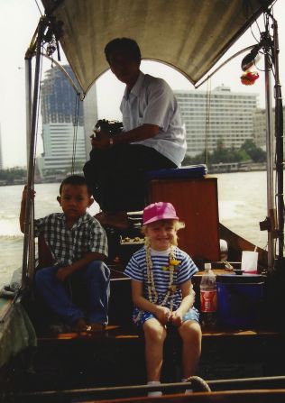 "Don't be afraid to try new things," says Dennis Disberger. "It's really fun to try new foods and meet new people."  Monica enjoys a boat ride with a new-found friend in Bangkok, Thailand.