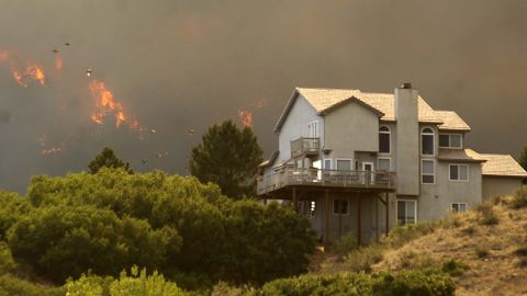 The Waldo Canyon Fire invades the Mountain Shadows neighborhood of Colorado Springs, Colorado, on Tuesday.