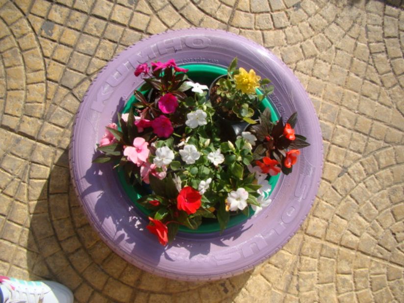 YNCA, a youth civil activism organization in Nabatieh, southern Lebanon, has been painting car tires and repurposing them as flower pots, coffee tables and book shelves around the city center.