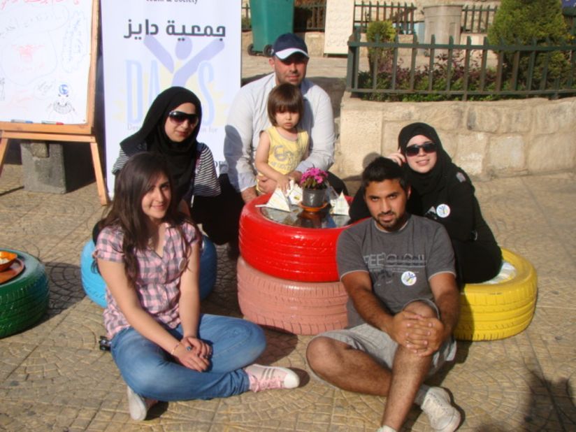 Young people gather at a coffee table made of car tires in the center of Nabatieh, southern Lebanon. The initative began when the army shooting of a cleric recently raised tensions around the country.