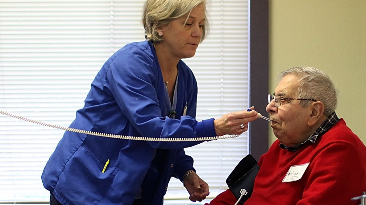 An elderly man gets medical care at a health care center in Novato, California. 