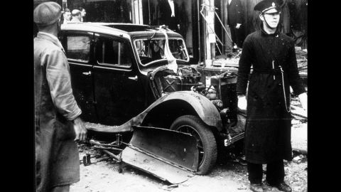A car sits in rubble at the scene of an IRA bombing in Coventry, England, in 1939. The bomb was planted in the basket of a tradesman's bicycle and killed five people. 
