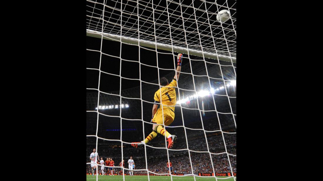 Spanish goalkeeper Iker Casillas jumps for the ball during the semifinal match.