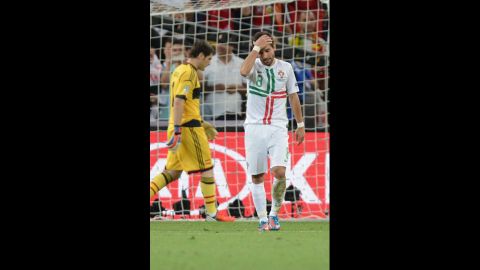 Portuguese midfielder Joao Moutinho reacts after he fails to score a penalty shot against Spanish goalkeeper Iker Casillas.