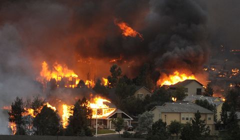 The Waldo Canyon fire spreads through a neighborhood in the hills above Colorado Springs on June 26. See more photos at <a href="http://www.denverpost.com/" target="_blank" target="_blank">The Denver Post</a>.