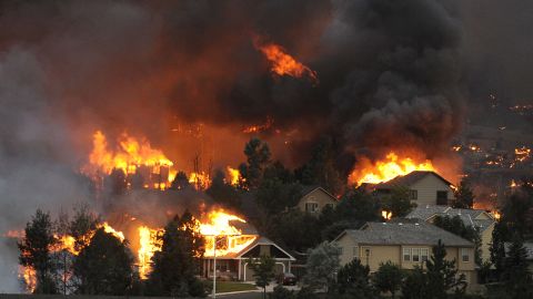 The Waldo Canyon fire spreads through a neighborhood in the hills above Colorado Springs on June 26. See more photos at <a href="http://www.denverpost.com/" target="_blank" target="_blank">The Denver Post</a>.