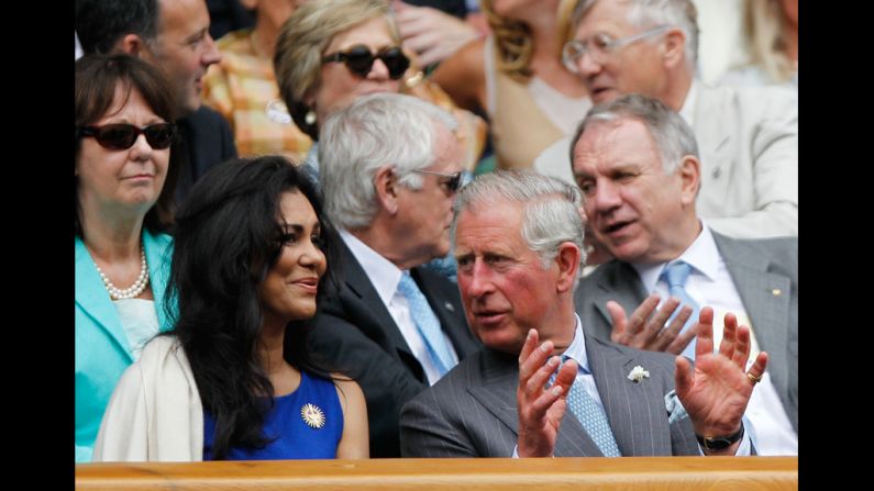 Prince Charles chats with Lady Winnie Forsyth on Wednesday as Roger Federer of Switzerland plays Fabio Fognini of Italy.