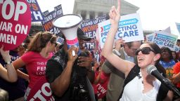 WASHINGTON, DC - JUNE 28: Local resident Angela Botlicella (R), along with other Obamacare supporters, celebrate as they respond to the Supreme Court ruling on the Affordable Health Act June 28, 2012 in front of the U.S. Supreme Court in Washington, DC. The Supreme Court has upheld the whole healthcare law of the Obama Administration. (Photo by Alex Wong/Getty Images) 
