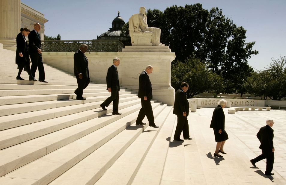 Justices file out of the Supreme Court building during funeral services for Chief Justice William Rehnquist on September 7, 2005. Following Rehnquist's death, President Bush announced Robert's new nomination to the position of chief justice.