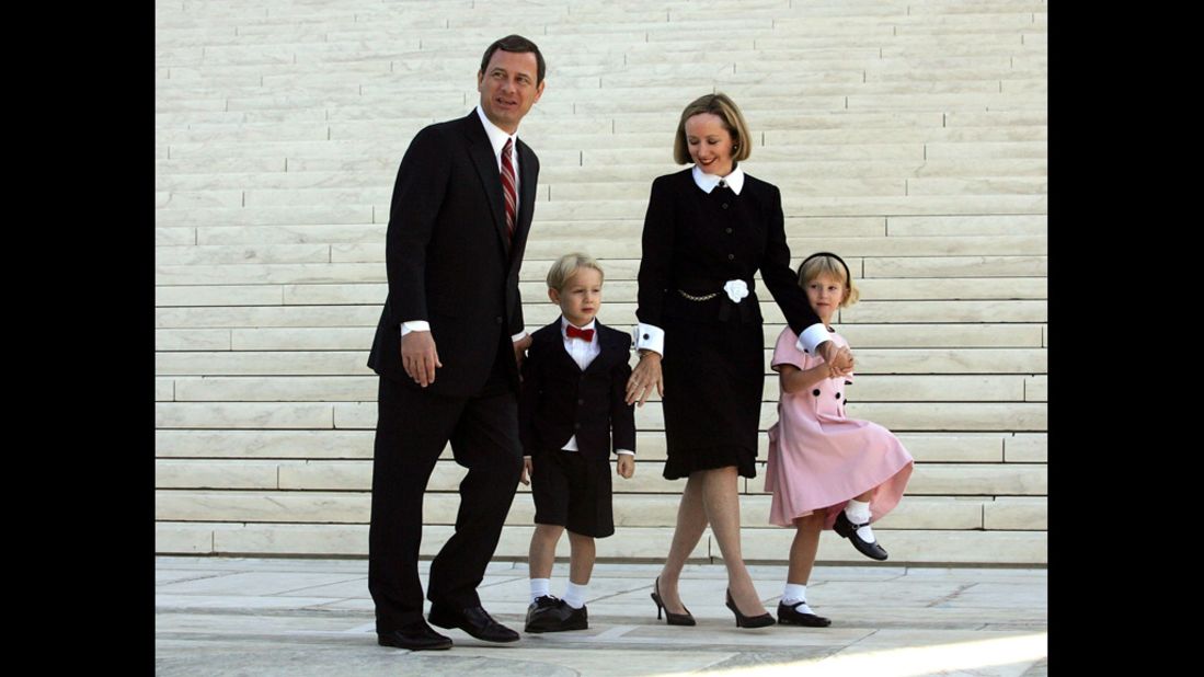 After taking the Supreme Court bench for the first time, Chief Justice Roberts leaves with his wife, Jane, and their children, Jack and Josie, on October 3, 2005.
