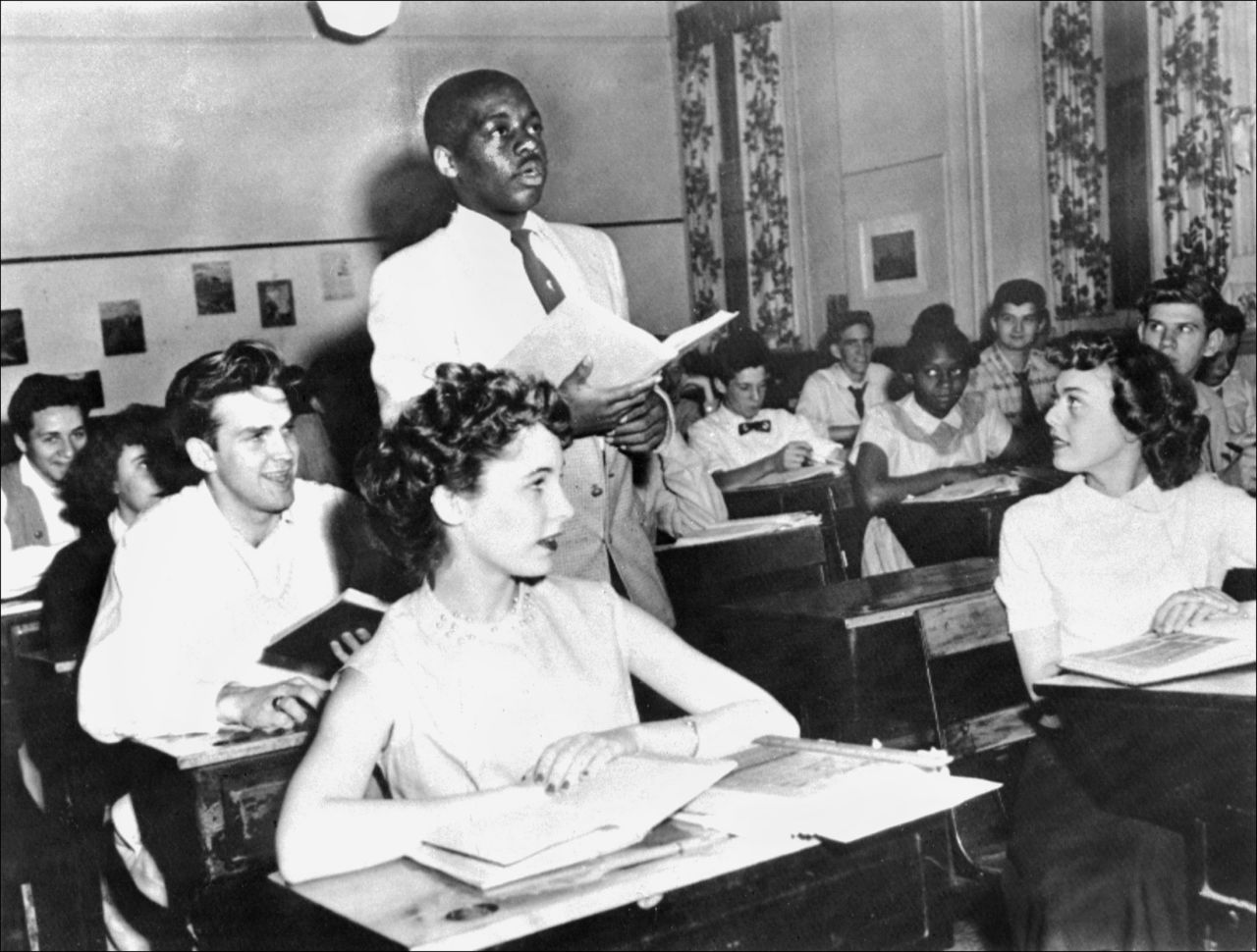 <strong>Brown v. Board of Education (1954):</strong> Nathaniel Steward recites his lesson surrounded by white classmates at the Saint-Dominique School in Washington. In Brown v. Board of Education, the Supreme Court ruled that it was unconstitutional to separate students based on race. 