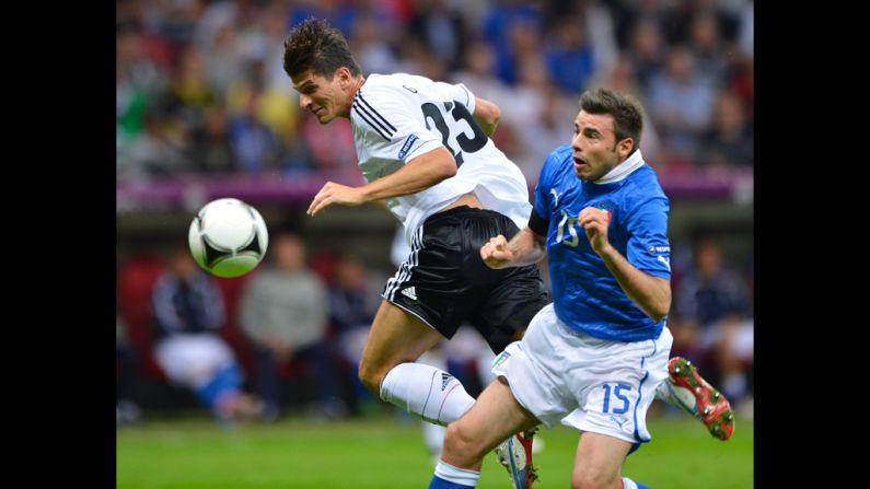 German midfielder Ilkay Guendogan vies with Italian defender Andrea Barzagli.