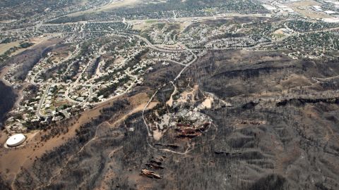 The line where the Waldo Canyon Fire stopped moving east is seen from the air in Colorado Springs. Lower temperatures and lighter winds helped firefighters on Thursday in the battle against the fire.