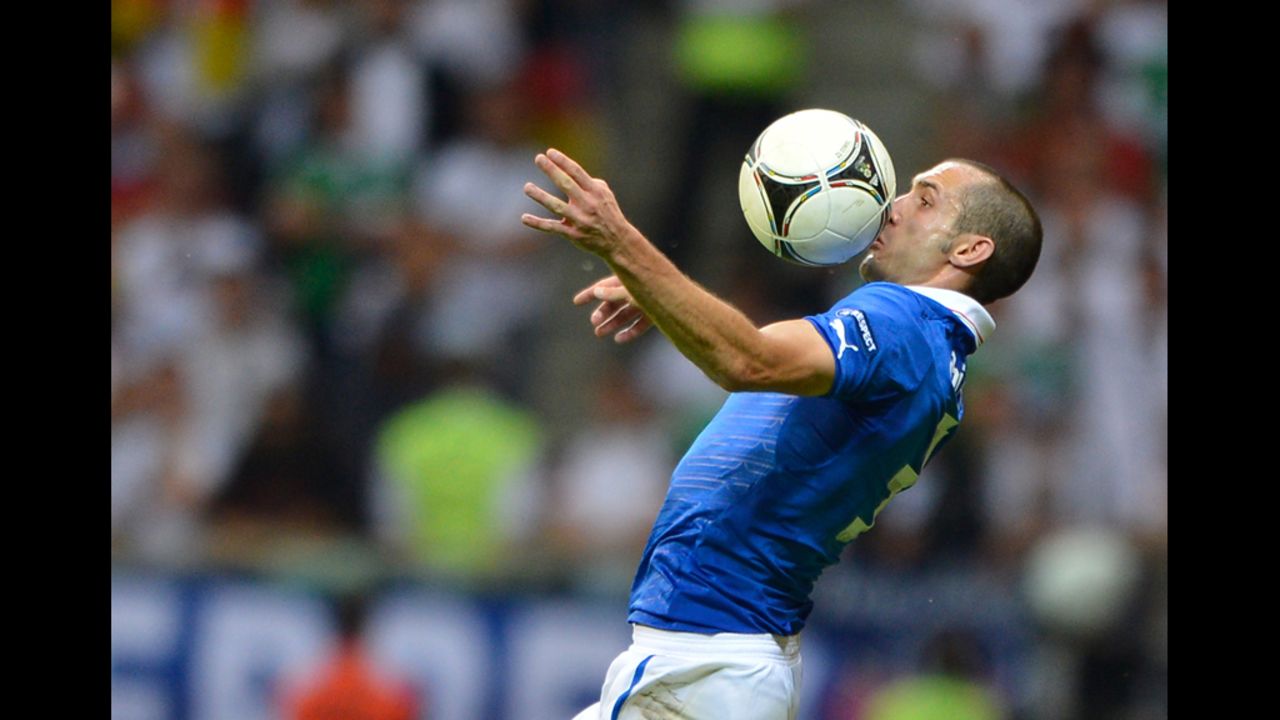 Italian defender Giorgio Chiellini heads the ball.